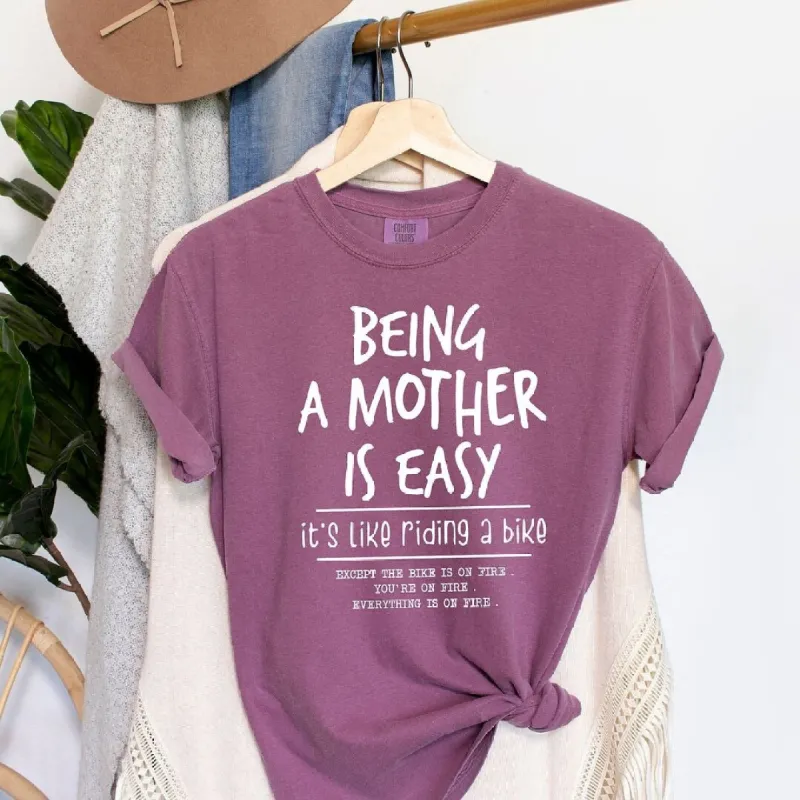 Being A Mother Is Easy Garment Dyed Tee sold by Zulily
