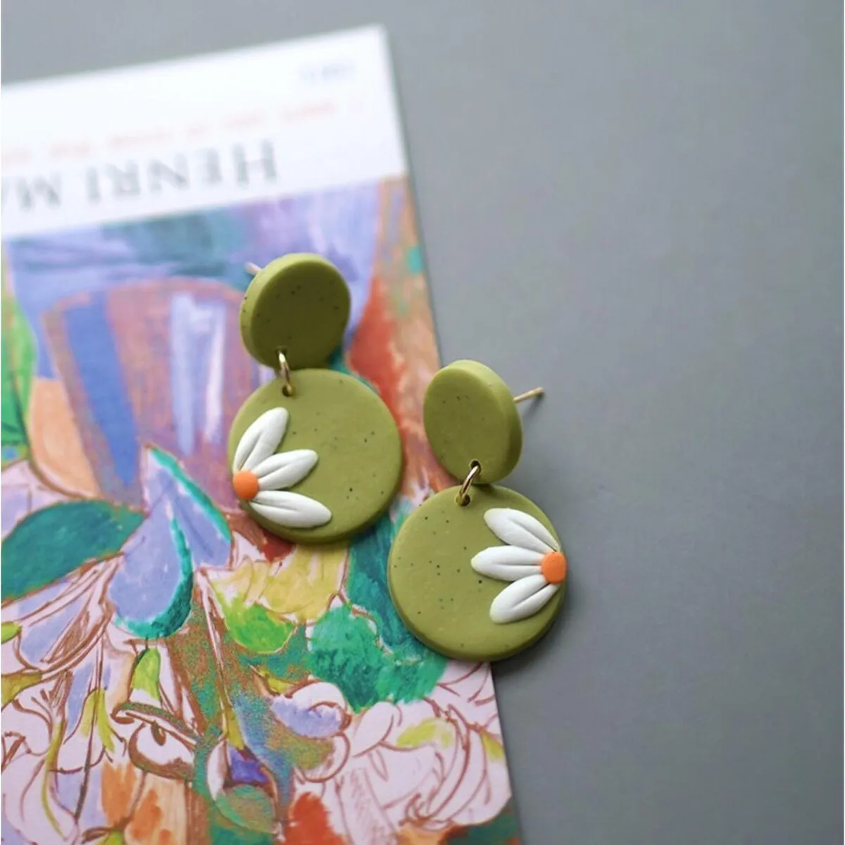 Goldtone Daisy Disc Clay Drop Earrings sold by Zulily product image thumbnail 2