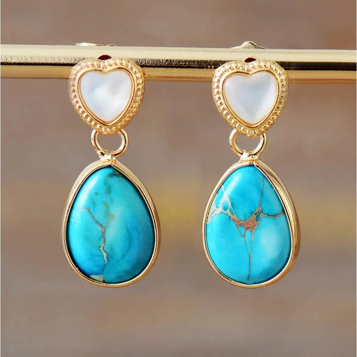 Goldtone Turquoise Jasper Teardrop & White Heart Drop Earrings sold by Zulily