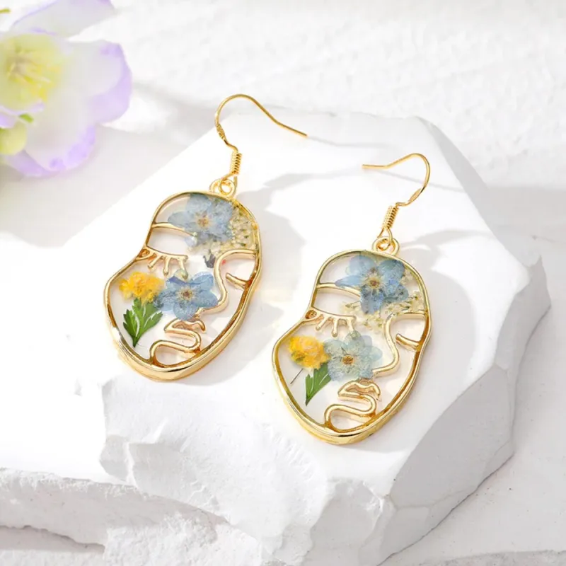 Goldtone Transparent & Floral Abstract Face Drop Earrings sold by Zulily