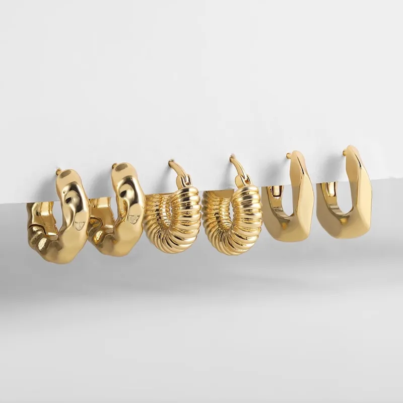 Goldtone - Triple Set - Textured Huggie Hoops sold by Zulily