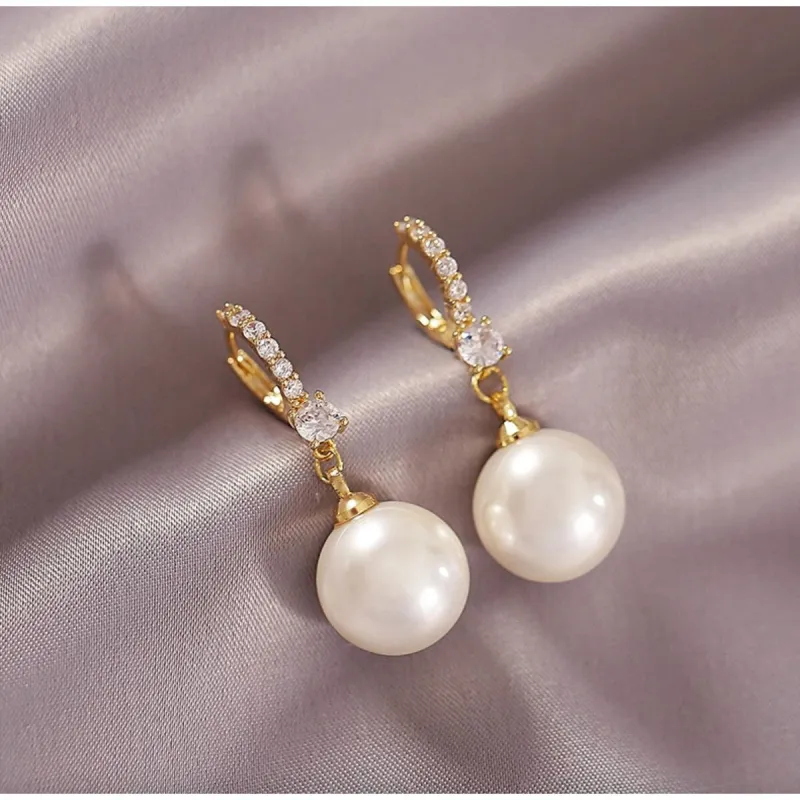 Goldtone Crystal Huggie Hoop Earrings With Faux Pearl sold by Zulily