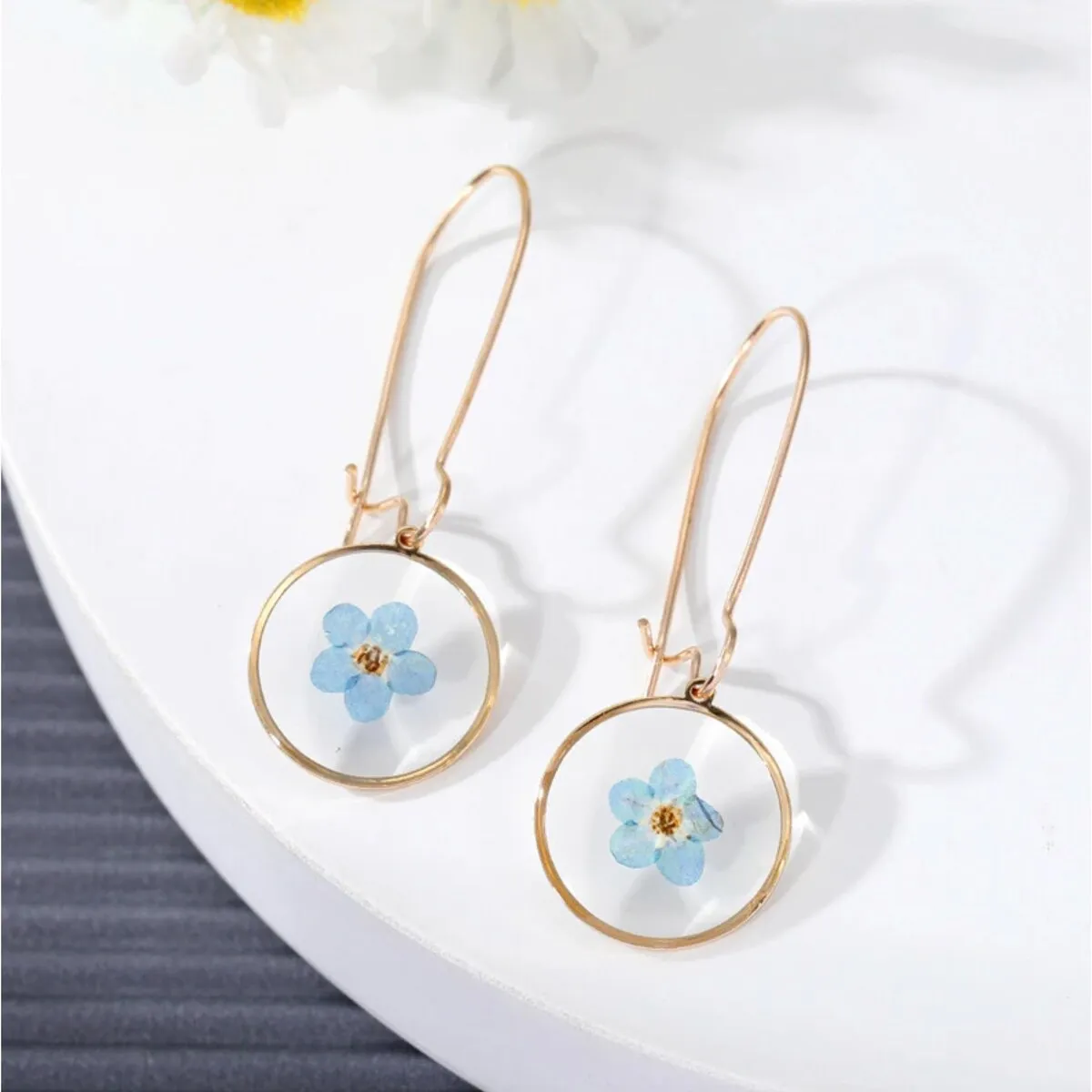 Goldtone & Transparent Blue Flower Circular Drop Earrings sold by Zulily
