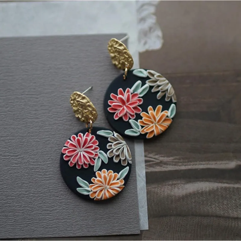 Goldtone & Black Circular Multi Colored Flower Earrings sold by Zulily