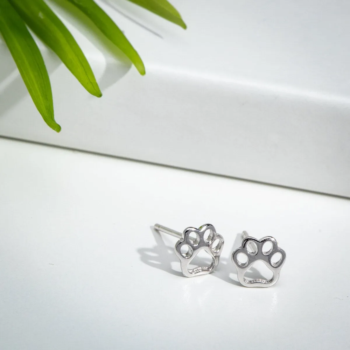 Sterling Silver Open Paw Print Stud Earrings sold by Zulily