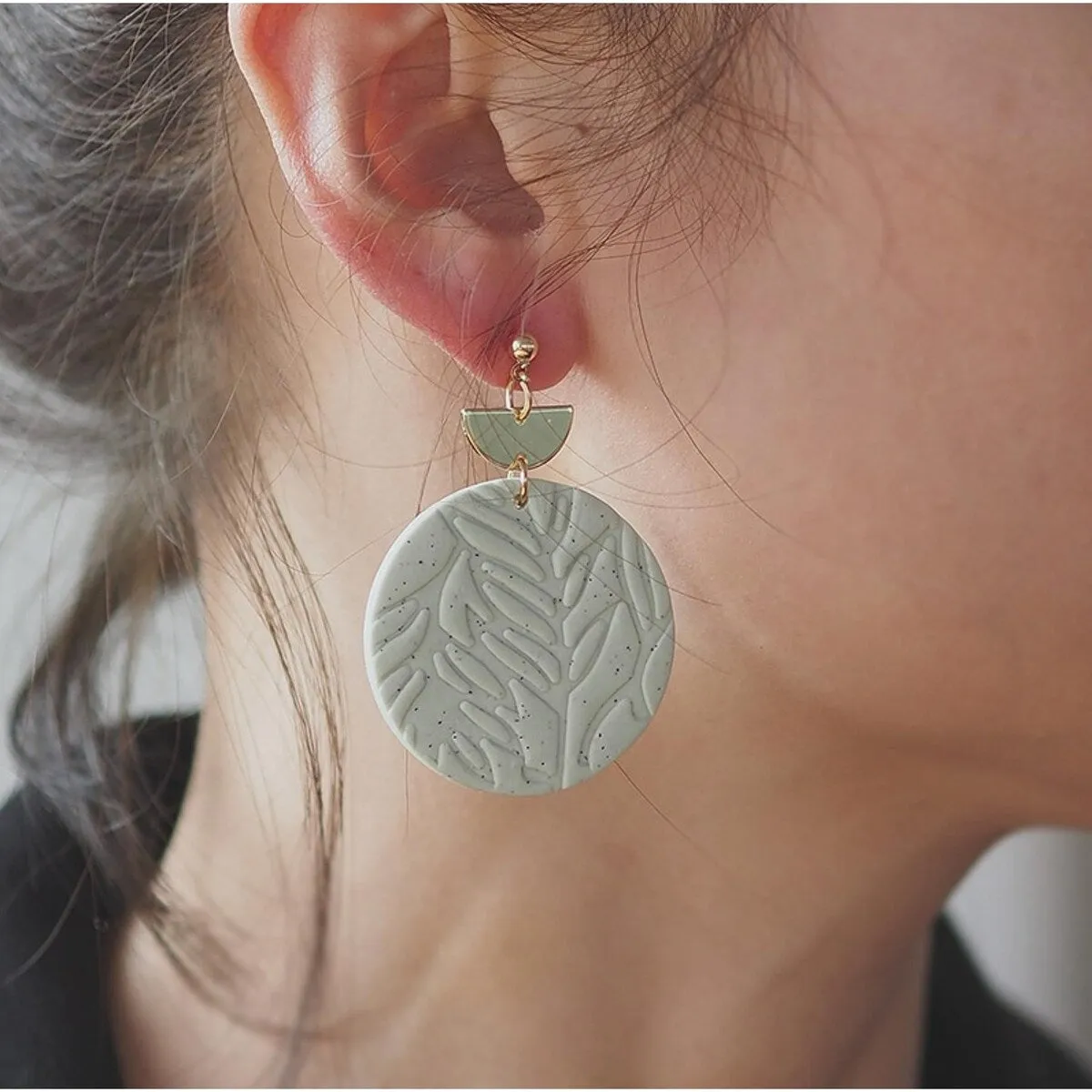 Goldtone & Green Circular Leaves Earrings sold by Zulily