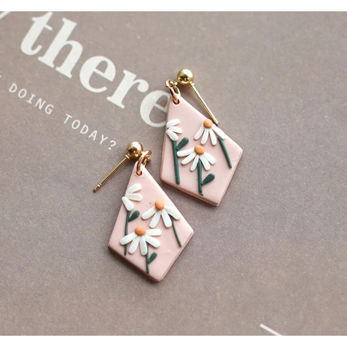 Pale Pink & White Daisy Diamond Shaped Drop Clay Earrings sold by Zulily