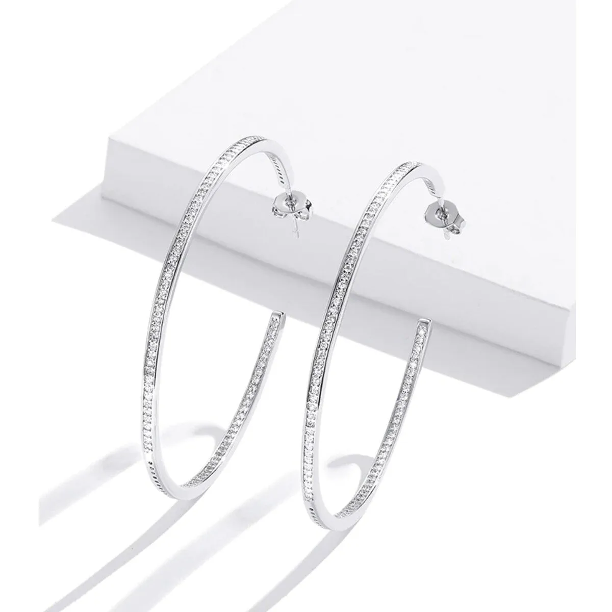 Sterling Silver Hoop Earrings with Cubic Zirconia sold by Zulily