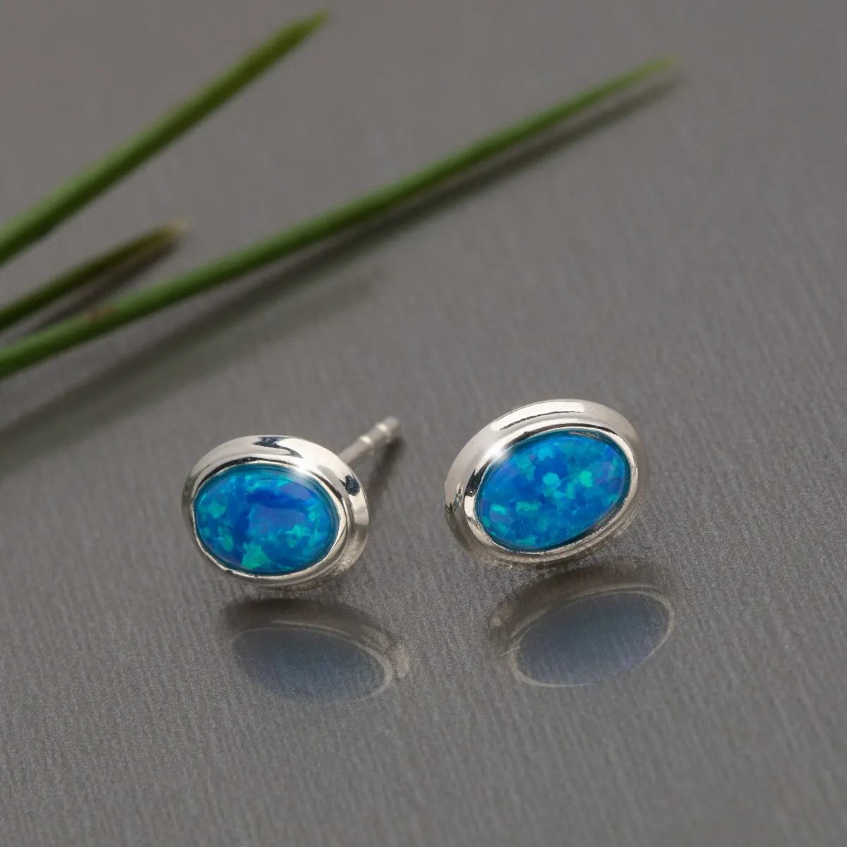 Sterling Silver Blue Lab Opal Oval Stud Earrings sold by Zulily