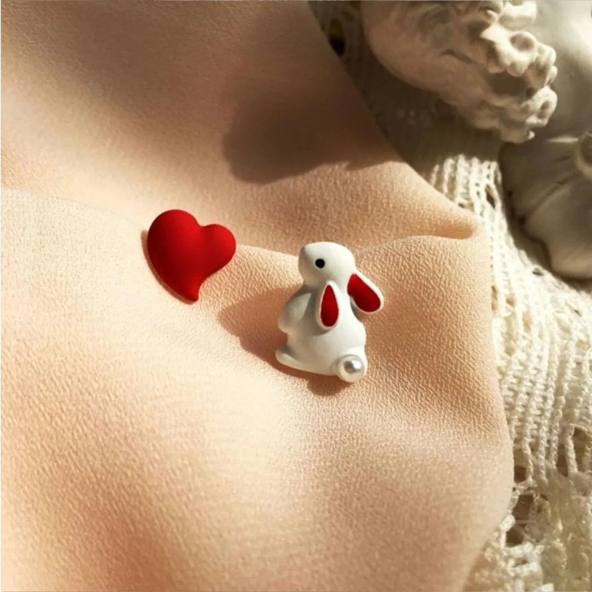 Asymmetrical White Bunny & Red Heart Stud Earrings sold by Zulily