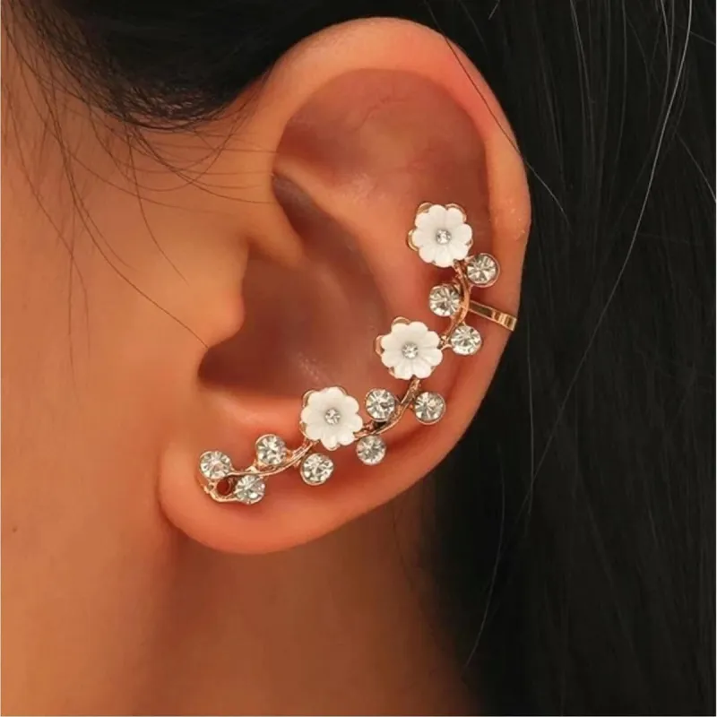 Goldtone Crystal & White Flower Ear Crawler sold by Zulily