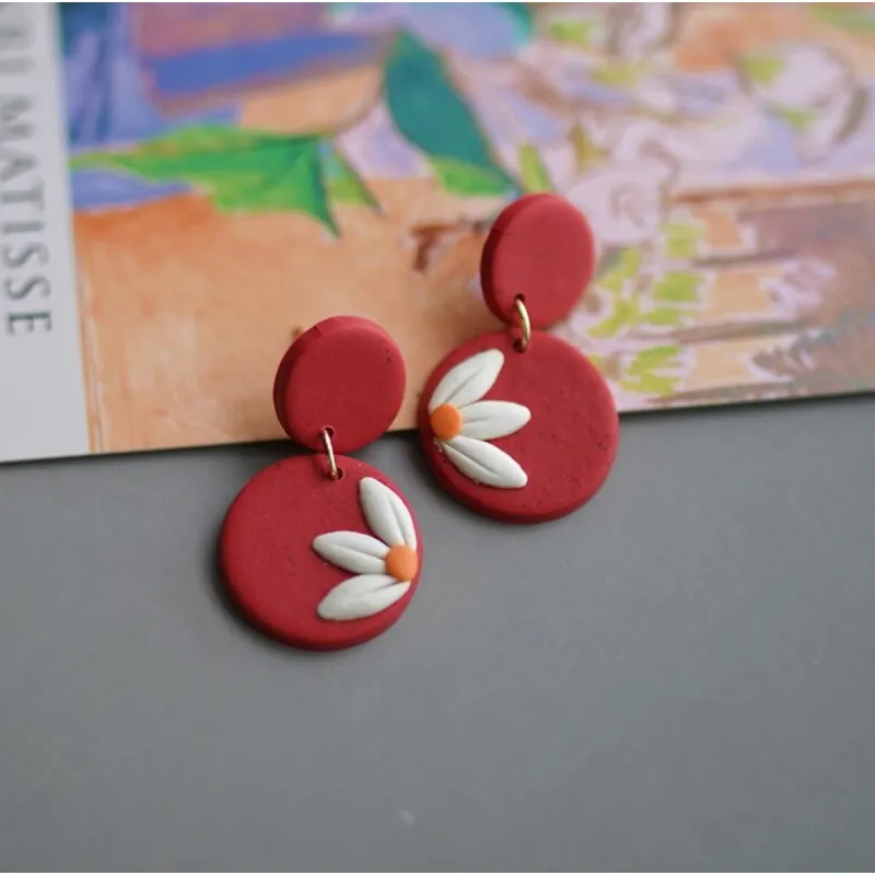 Red & Goldtone Daisy Disc Drop Earrings sold by Zulily