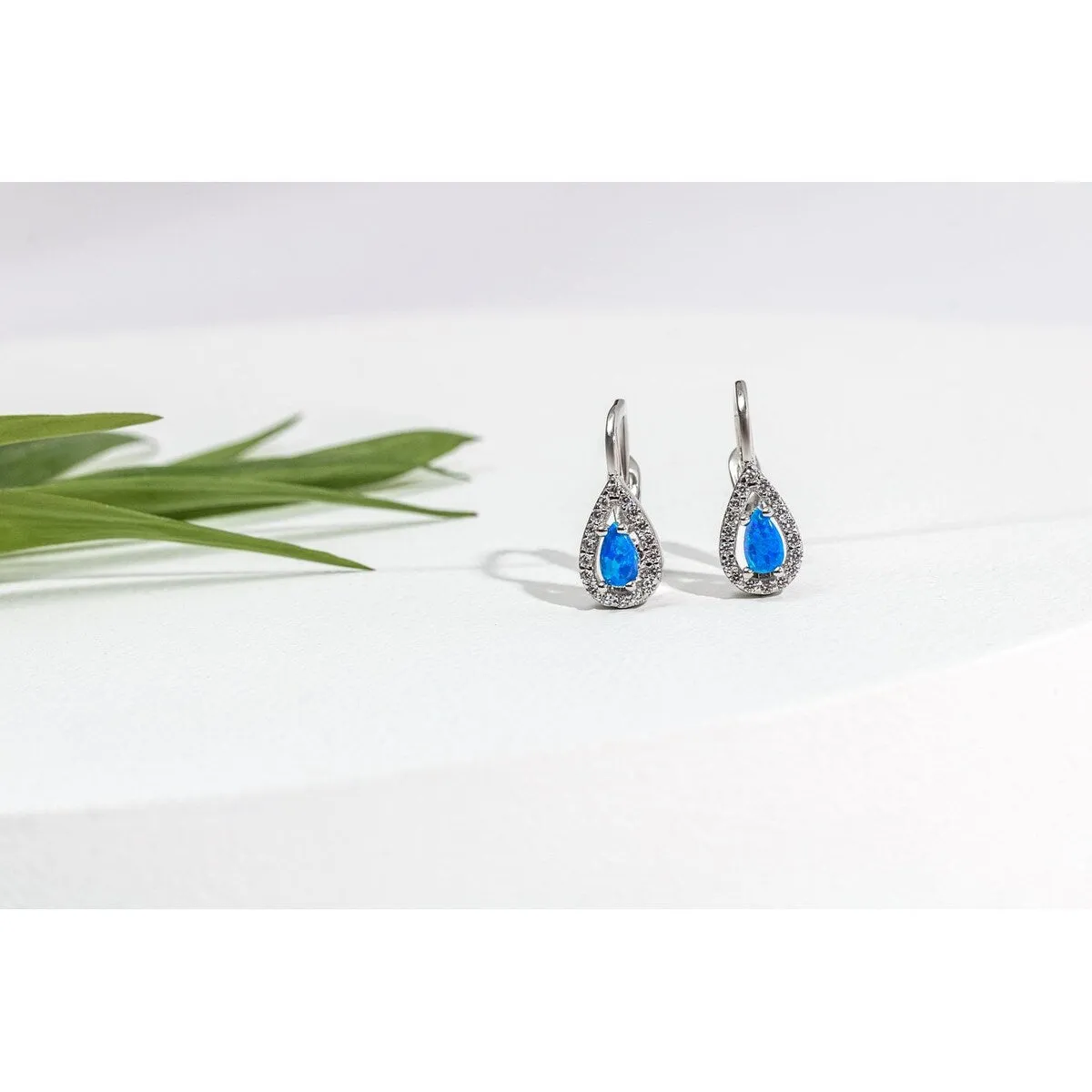 Sterling Silver Teardrop Huggie Earrings with Blue Lab-Created-Opal sold by Zulily