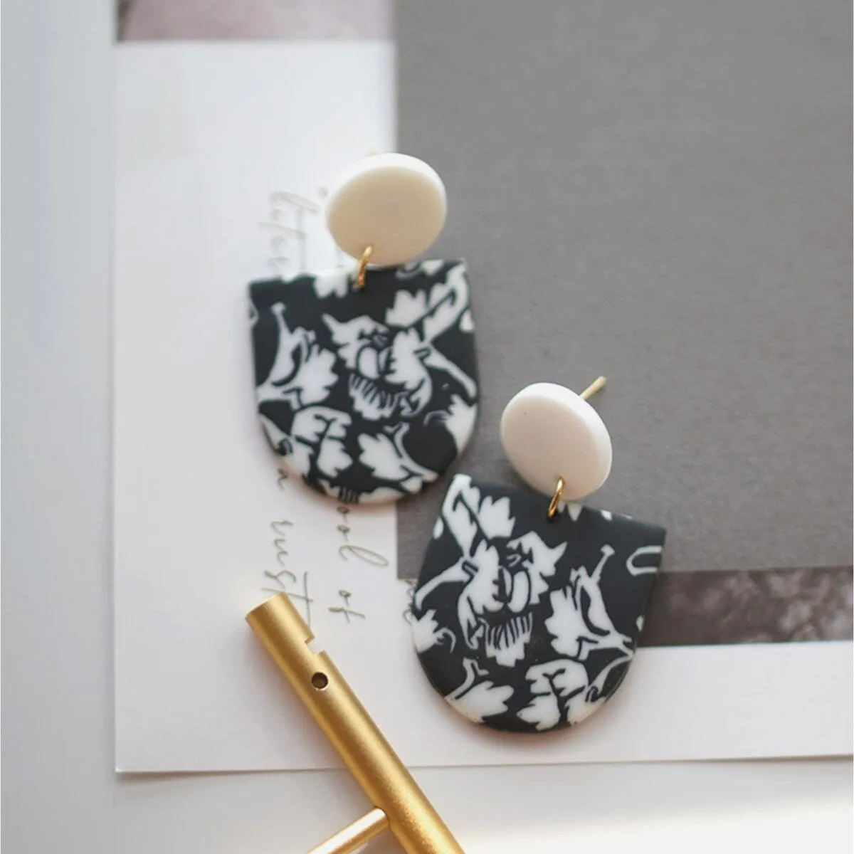 Black & White Floral Arched Drop Earrings sold by Zulily