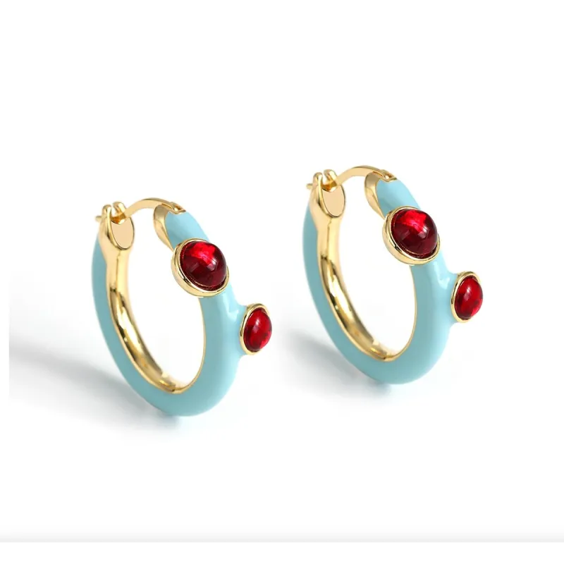 Goldtone Blue Huggie Hoop Earrings With Red Crystals sold by Zulily