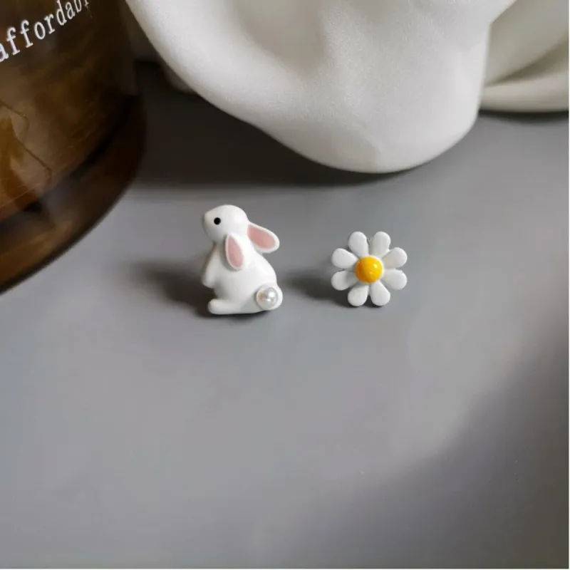 Asymmetrical White Bunny And Daisy Flower Stud Earrings sold by Zulily
