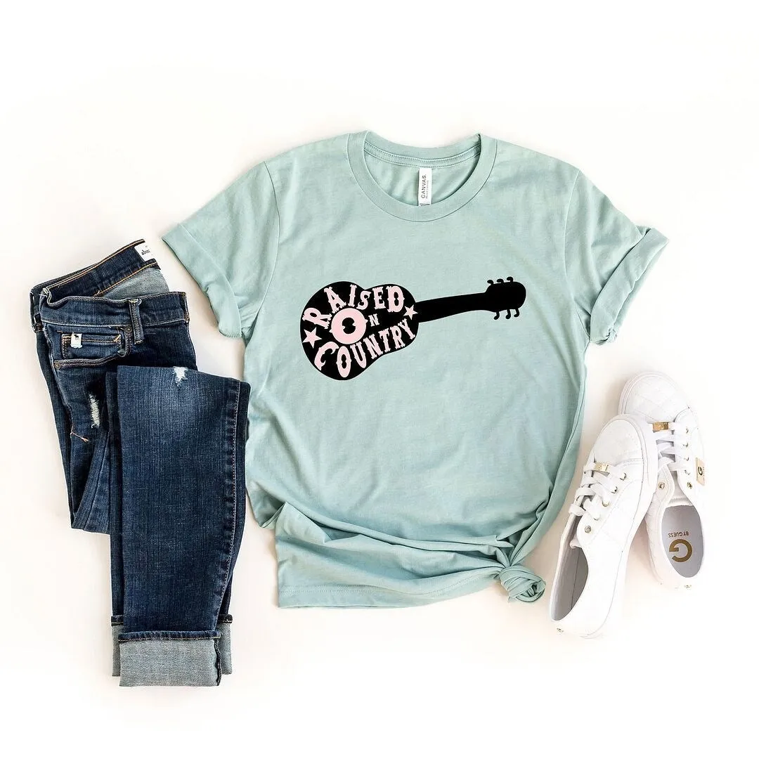 Raised On Country Guitar Short Sleeve Crewnneck Tee sold by Zulily