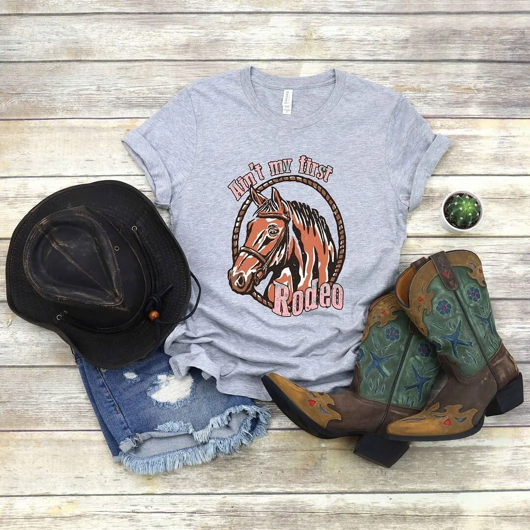 Ain't My First Rodeo Horse Short Sleeve Crewnneck Tee sold by Zulily