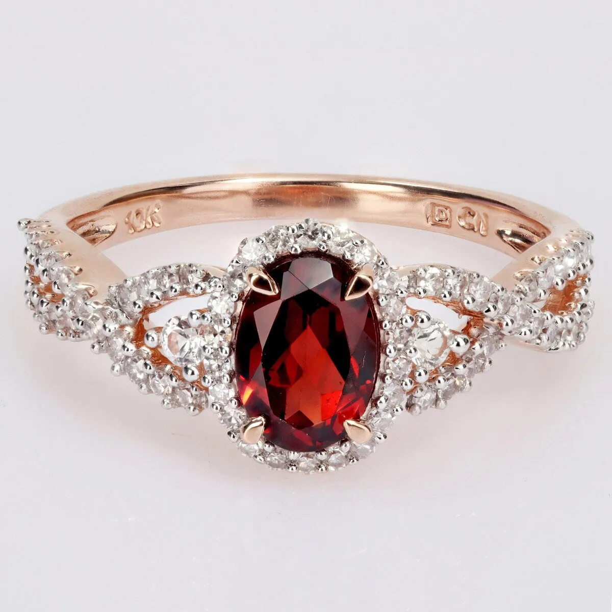 Miadora 10k Rose Gold Garnet, White Sapphire and 1/3ct TDW Diamond Halo Infinity Ring sold by Zulily