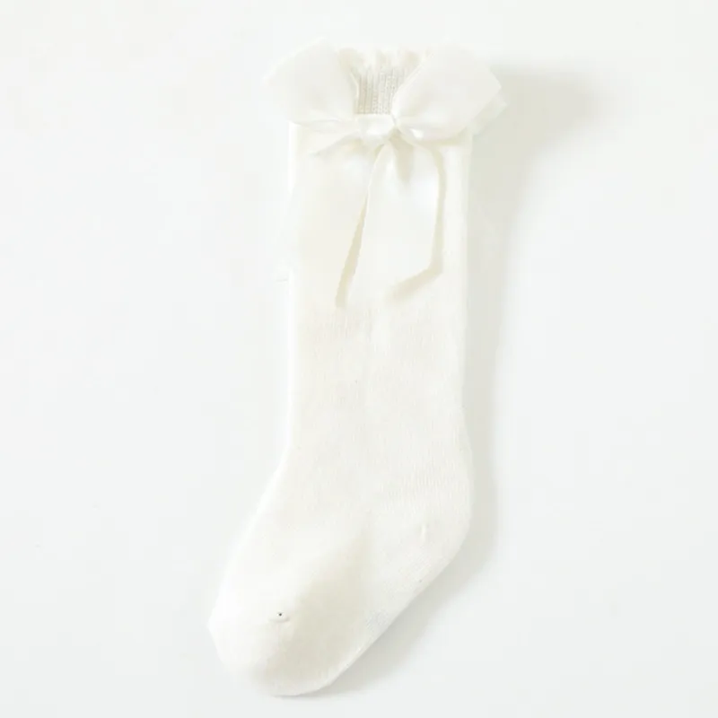 White Bow Socks sold by Zulily