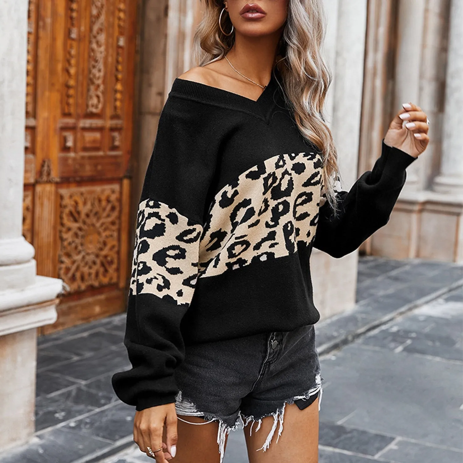 Black Leopard Color Block V-Neck Sweater sold by Zulily
