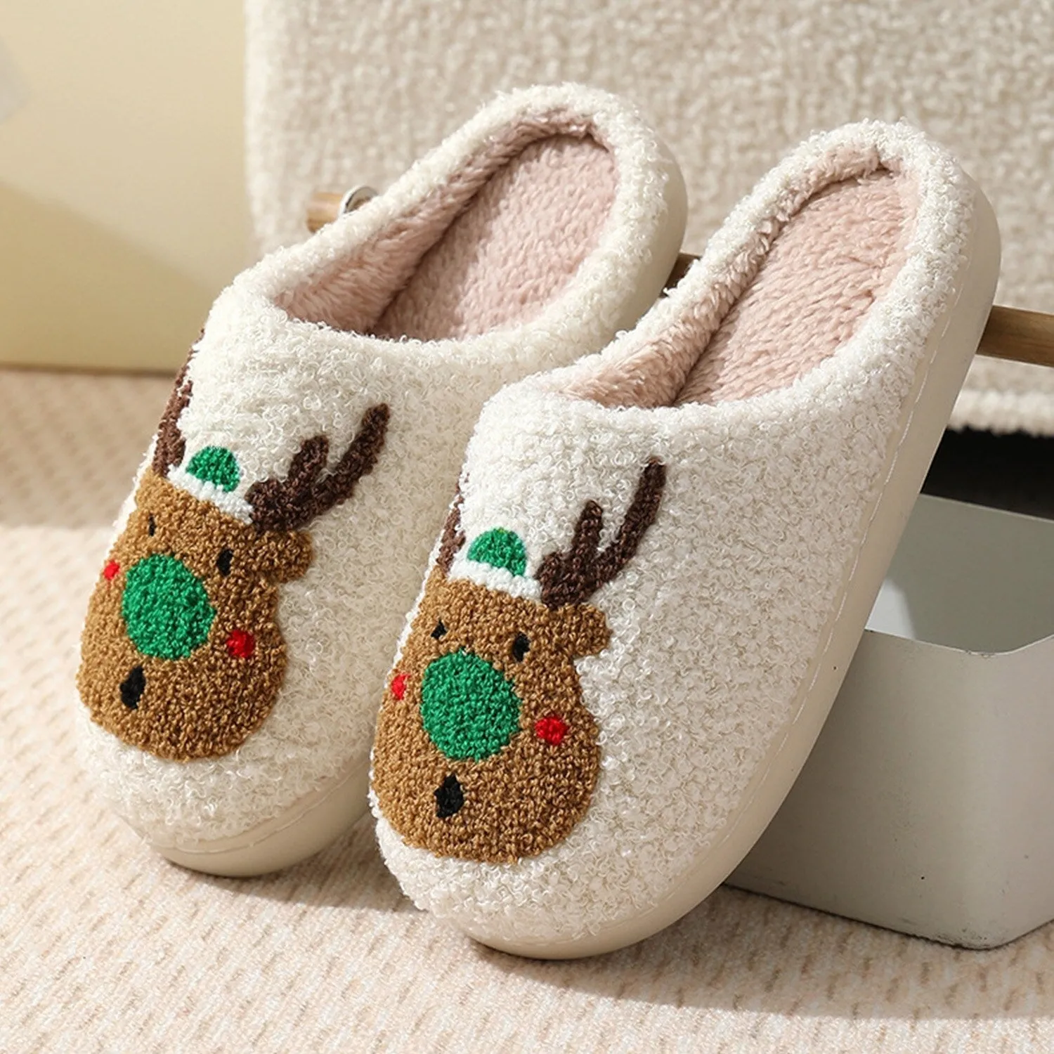 White & Green Christmas Reindeer Slippers sold by Zulily