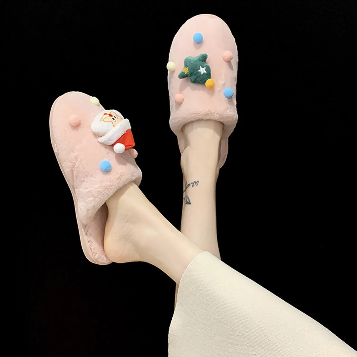 Pink Christmas Tree & Santa Slippers sold by Zulily