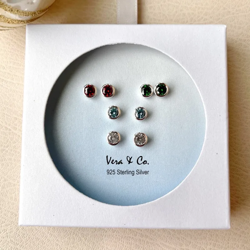 Sterling Silver Holiday Earrings 4-Pair Set of Red, Clear, Emerald Green, Blue CZ Round Stud sold by Zulily