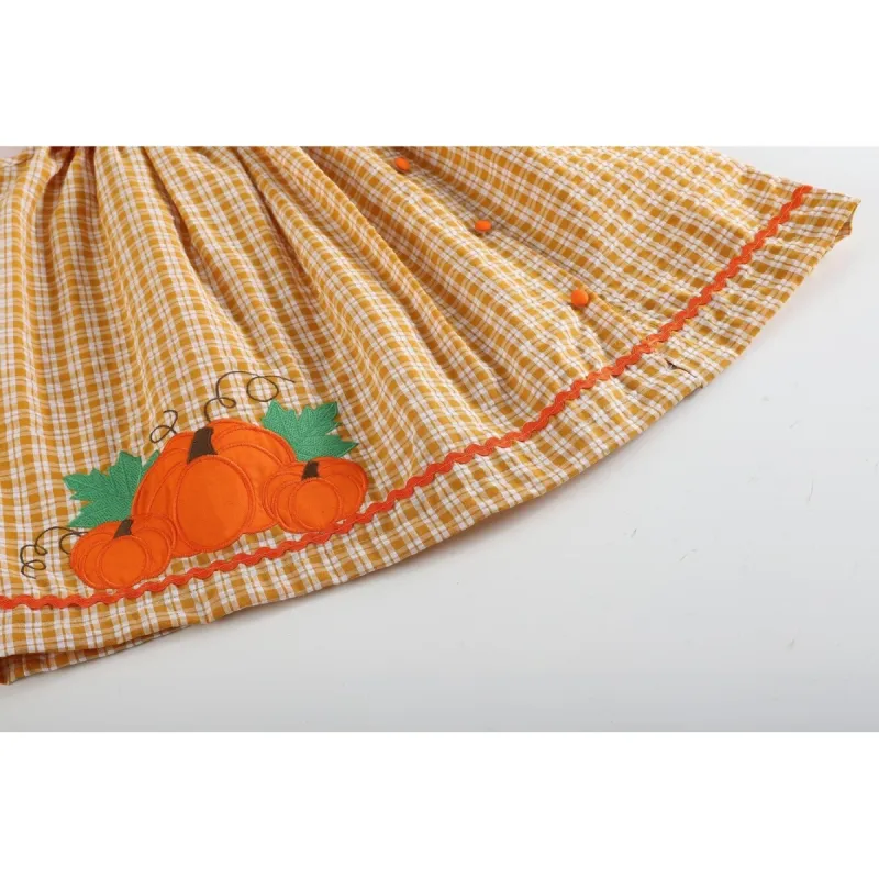 Orange Gingham Pumpkin Yoke Dress sold by Zulily