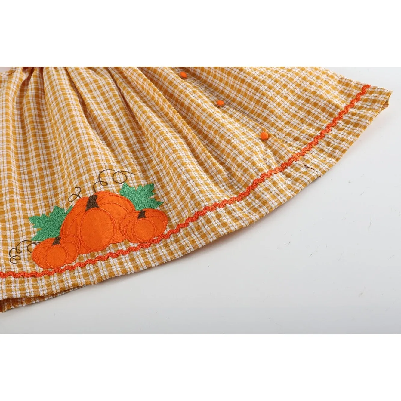Orange Gingham Pumpkin Yoke Dress sold by Zulily