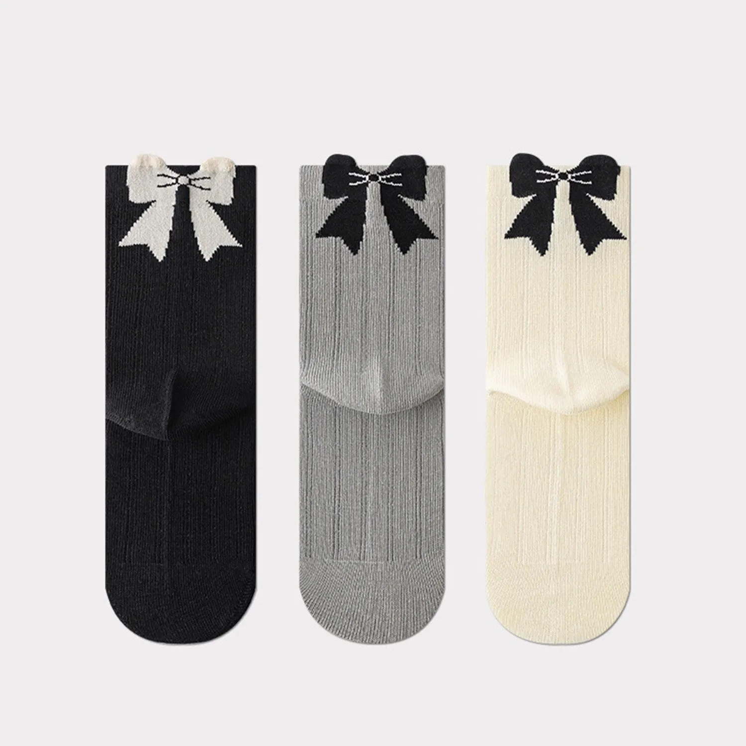 Grey Black & White Three-piece Bow Socks Set sold by Zulily