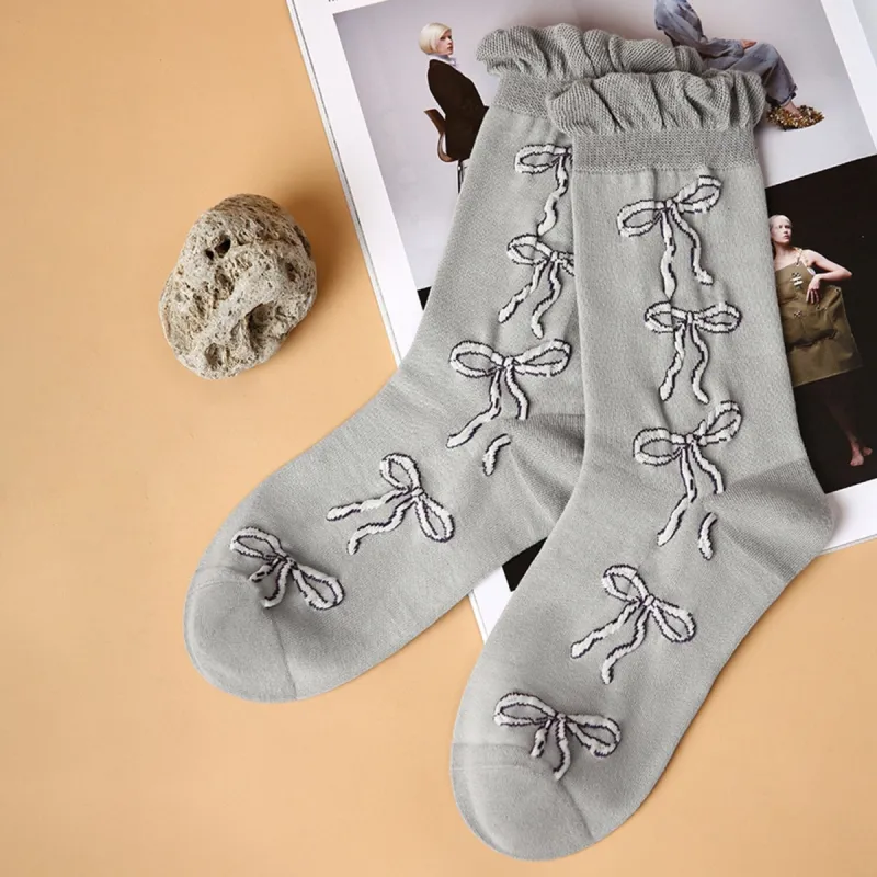 Grey & White Bow Socks sold by Zulily