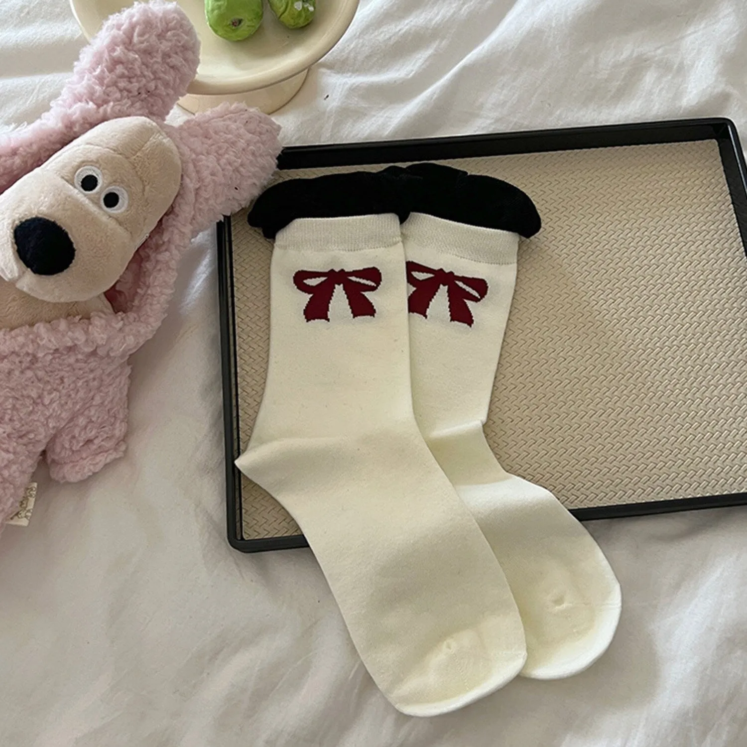 White Bow Socks sold by Zulily