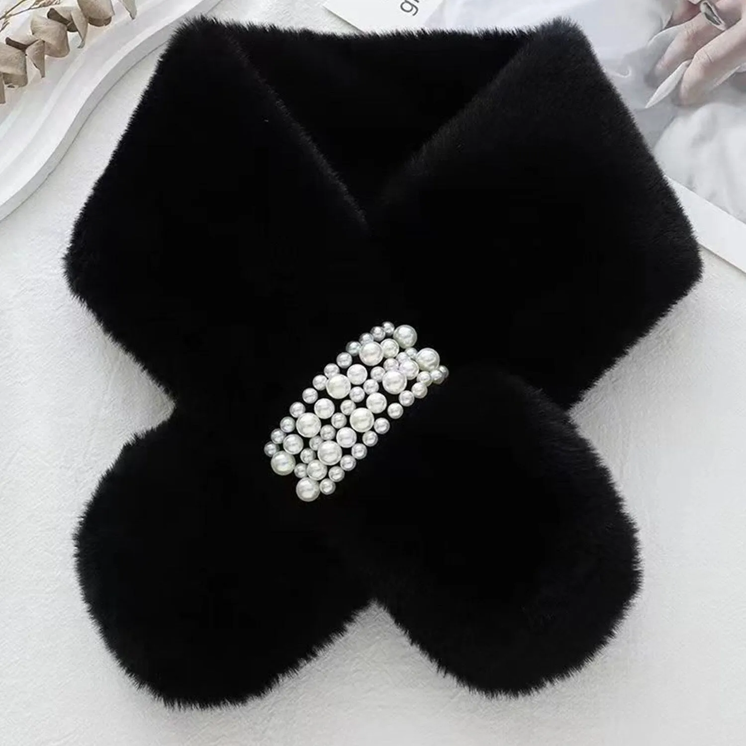 Black Plush Cross Pearl Scarf sold by Zulily