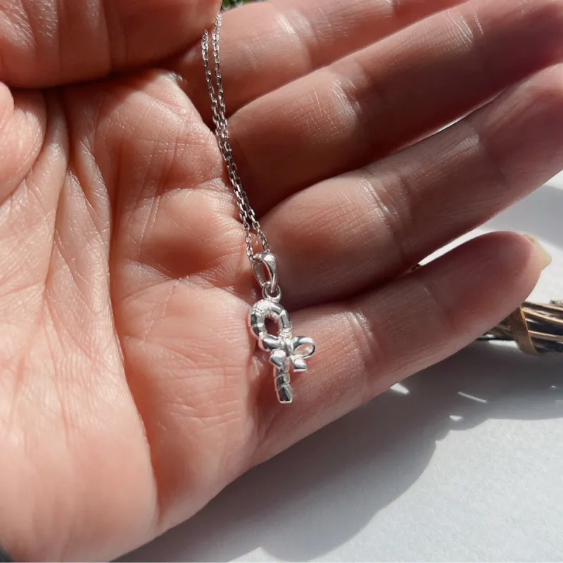 Sterling Silver Tiny Candy with bow Charm Necklace sold by Zulily