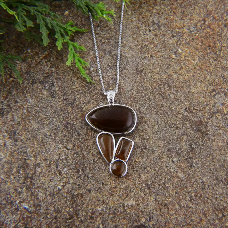 Sterling Brown Agate Multi-Shape Charm Necklace sold by Zulily