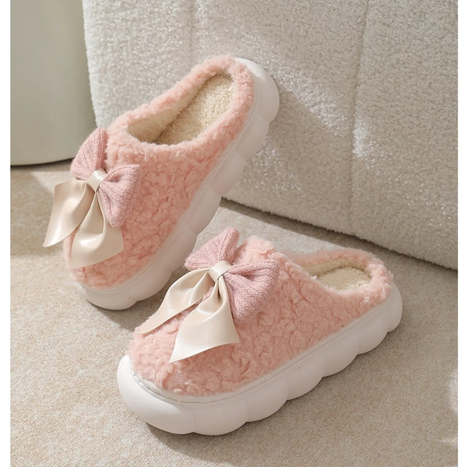 Pink Bow Plush Slippers sold by Zulily