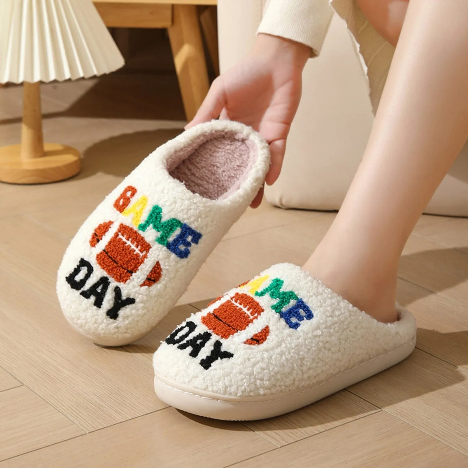 White & Brown Rugby Plush Slippers sold by Zulily