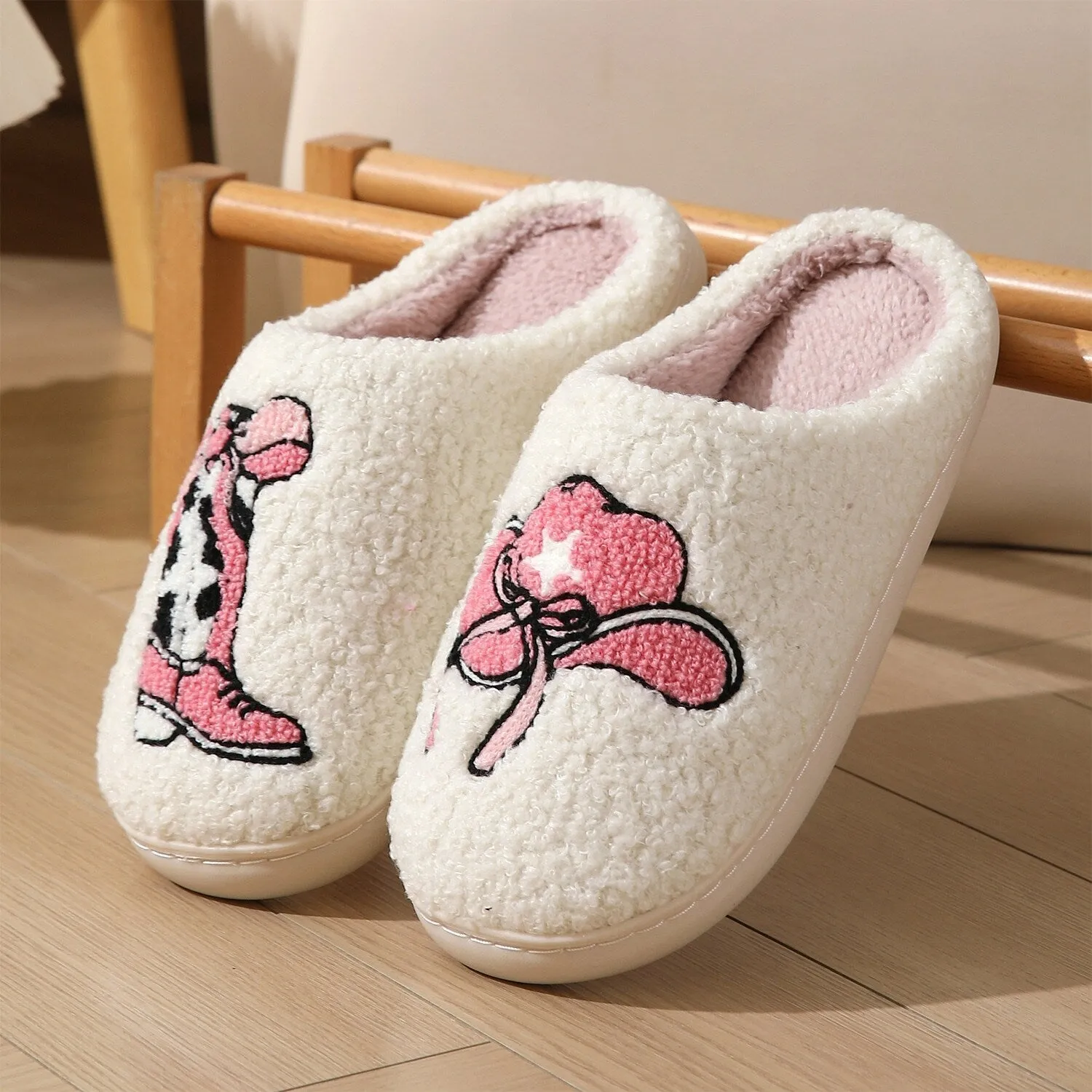 White & Pink Boots Plush Slippers sold by Zulily