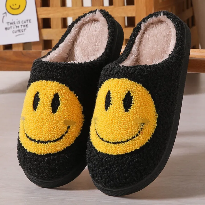 Black & Yellow Smiley Face Plush Slippers sold by Zulily