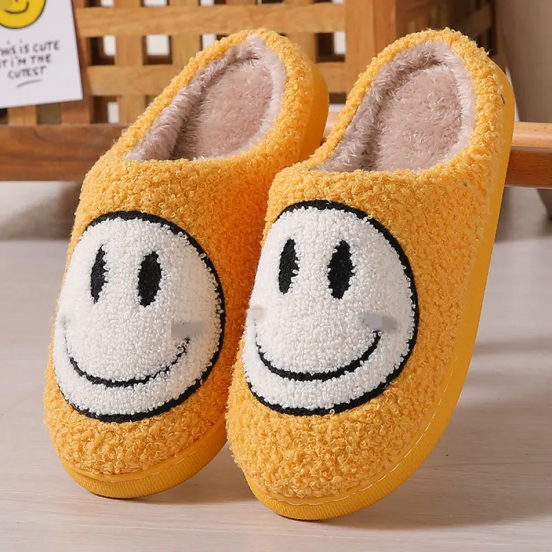 Yellow & White Smiley Face Plush Slippers sold by Zulily