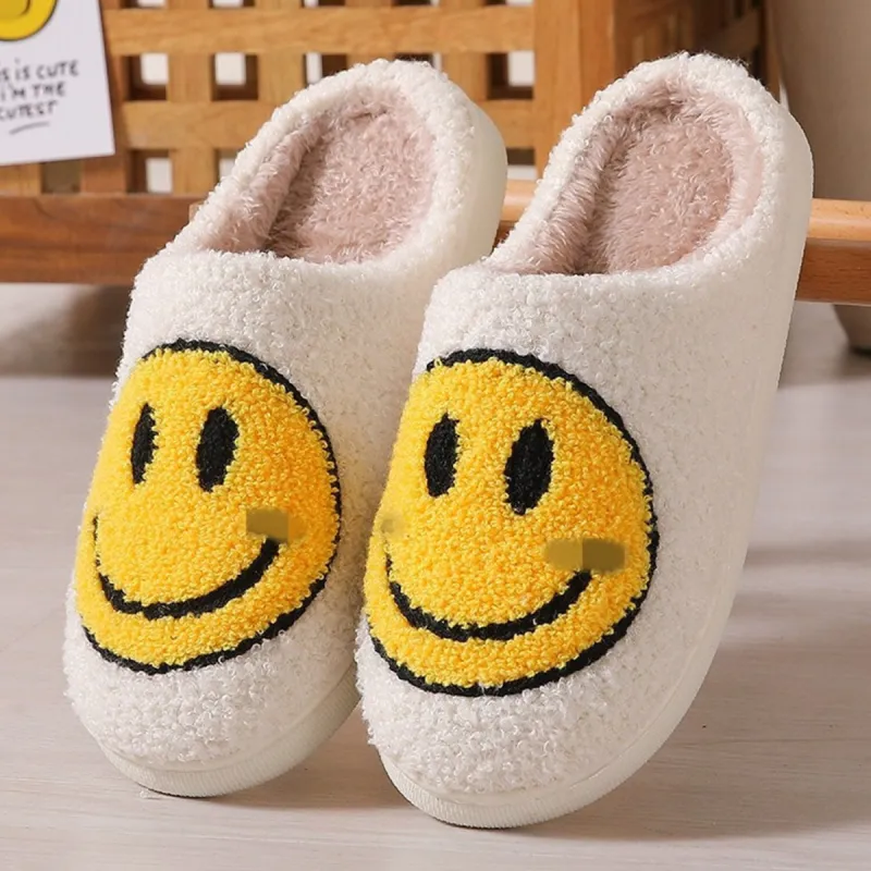 White & Yellow Smiley Face Plush Slippers sold by Zulily