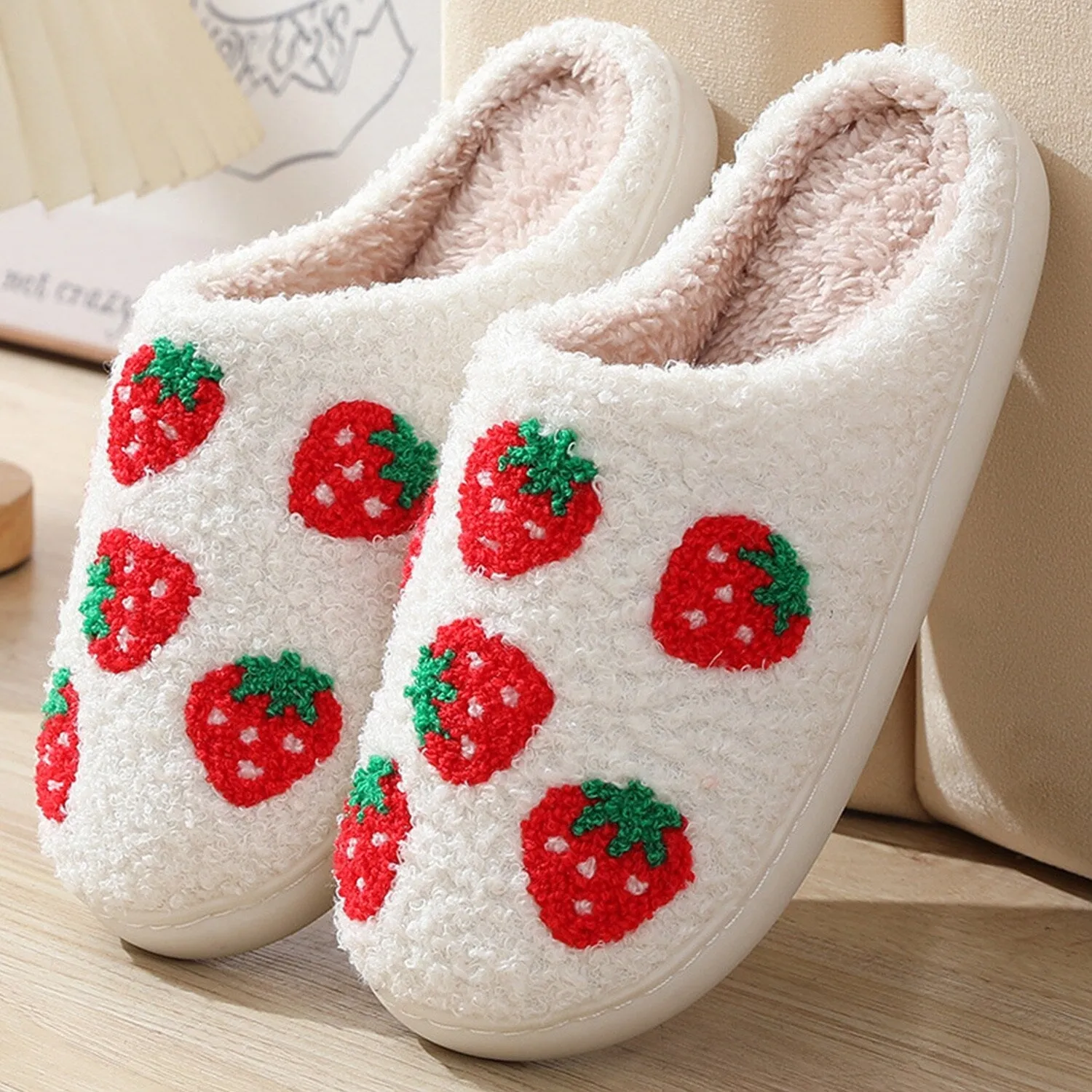 White & Red Strawberry Plush Slippers sold by Zulily