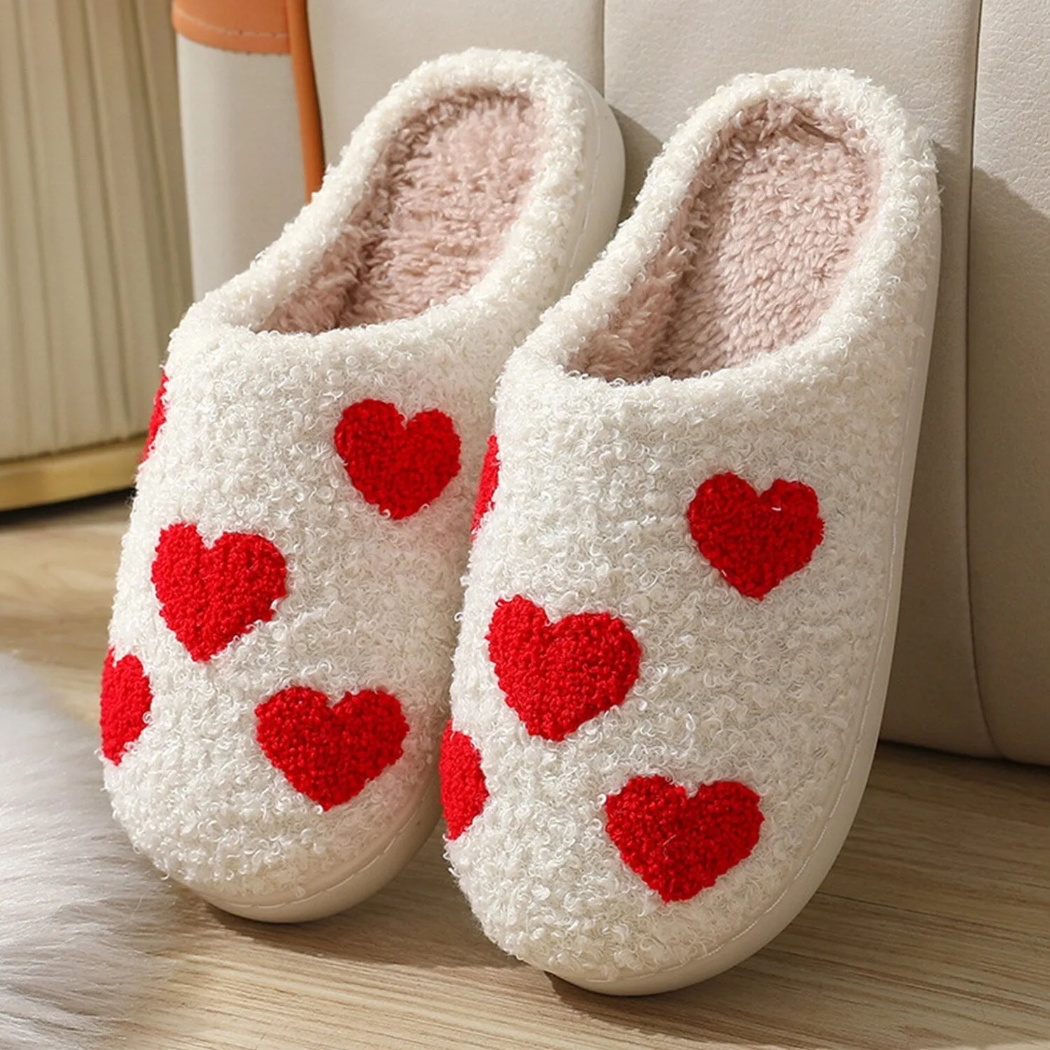 White & Red Heart Plush Slippers sold by Zulily