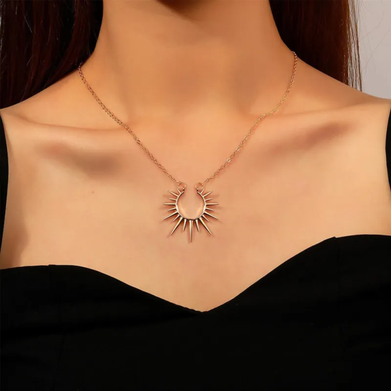Goldtone Open Sun Pendant Necklace sold by Zulily