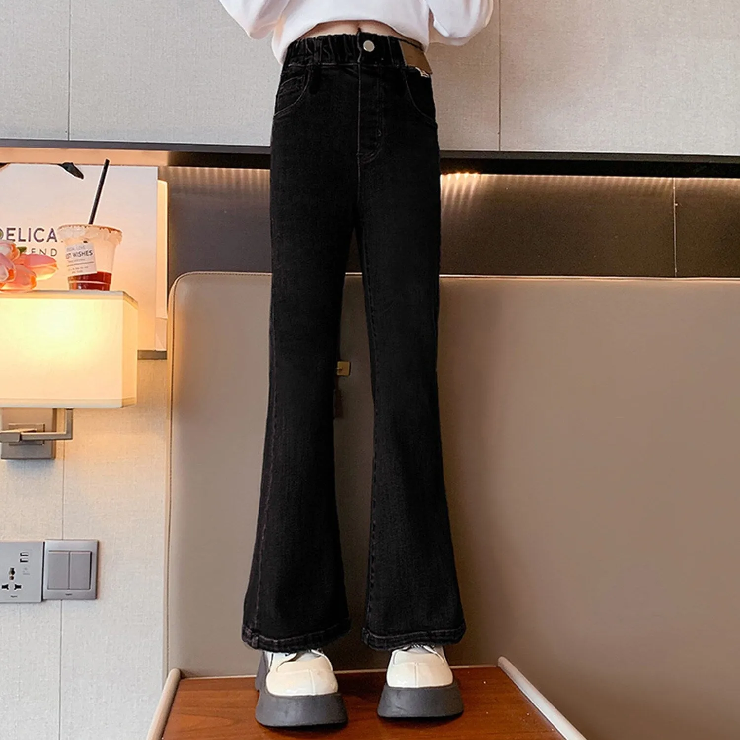 Black Denim Flared Pants sold by Zulily