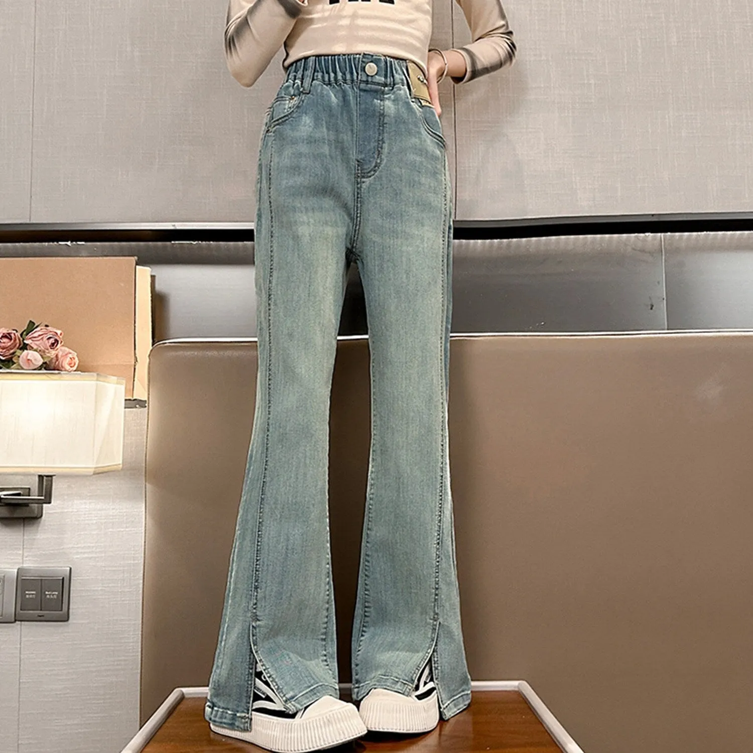 Light Blue Denim Slit Flared Pants sold by Zulily