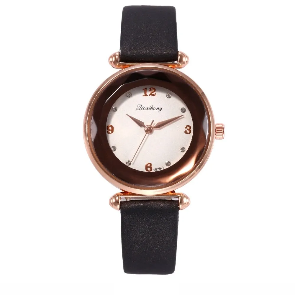 Black Faceted Bezel Faux Leather Watch sold by Zulily