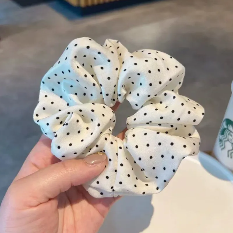 White Polka Dot Hair Tie sold by Zulily