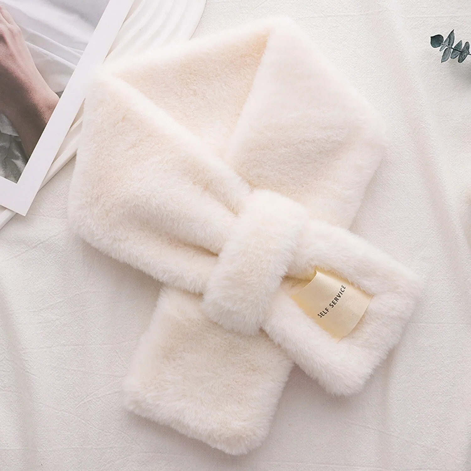 White Faux Fur Cross Scarf sold by Zulily